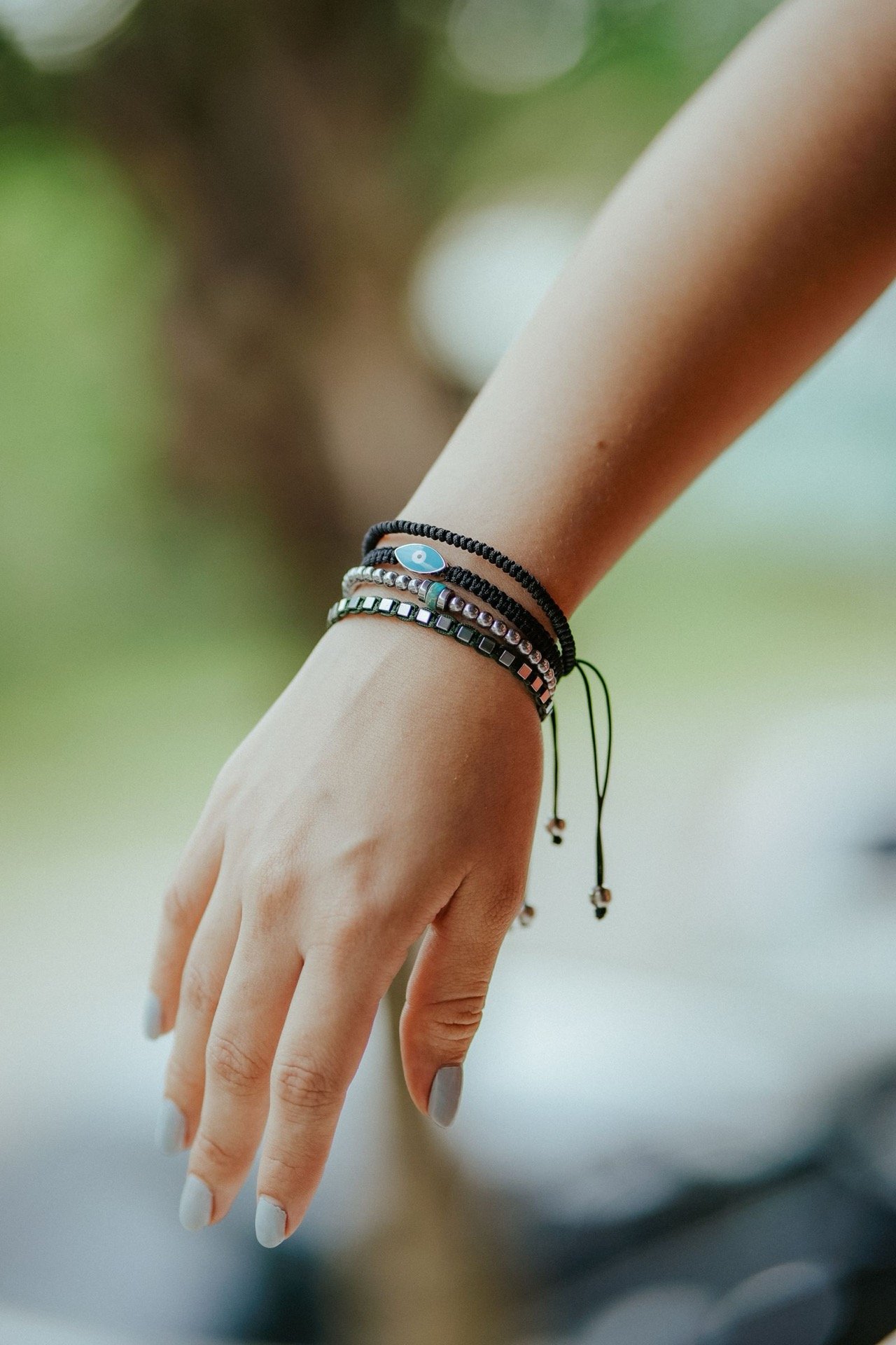 Stacked bracelets worn on a wrist