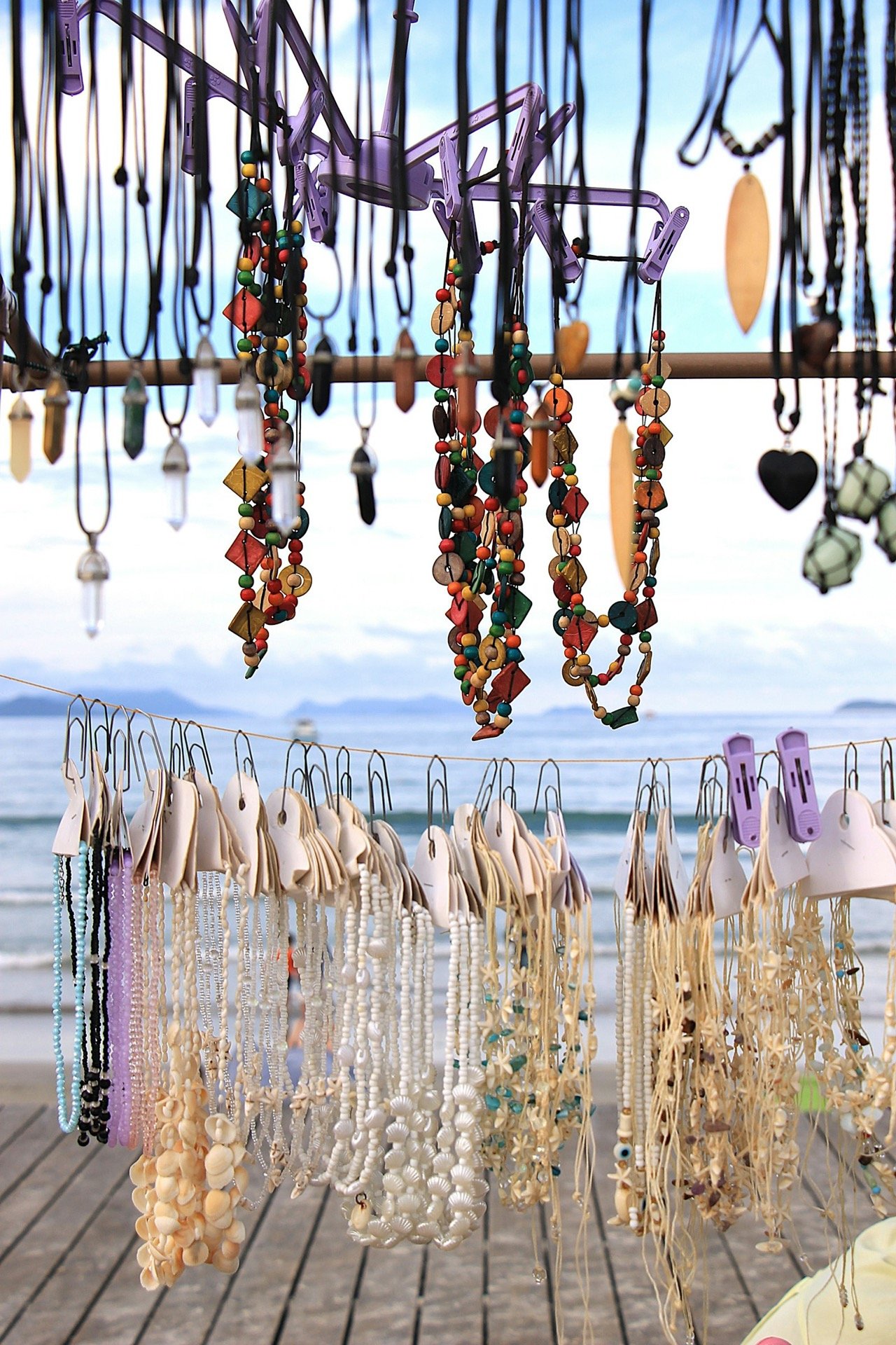 Handmade jewelry on display by the water