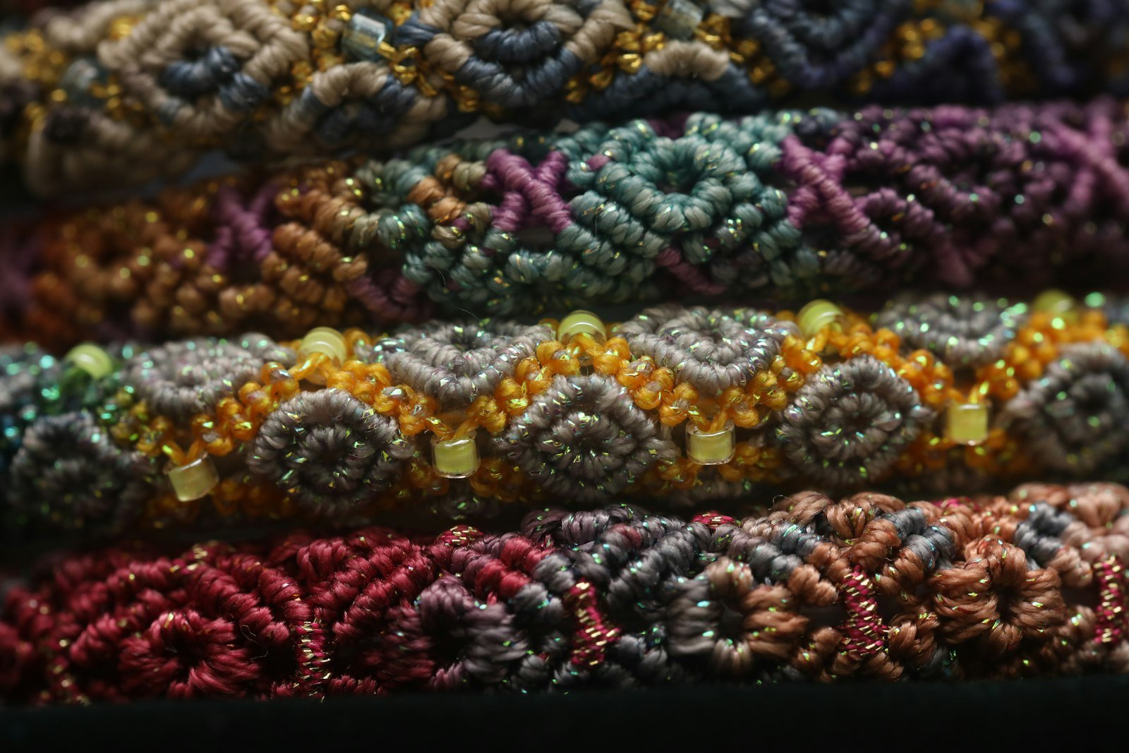 Stack of colorful woven friendship bracelets